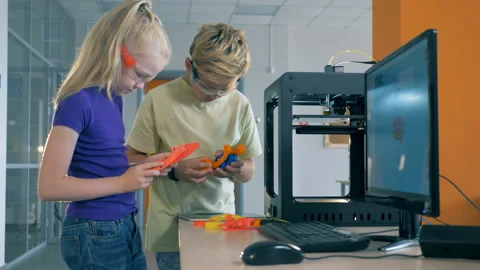 Pupils hold 3D printed elements at a school modern laboratory. Invention concept Stock Footage 93561169