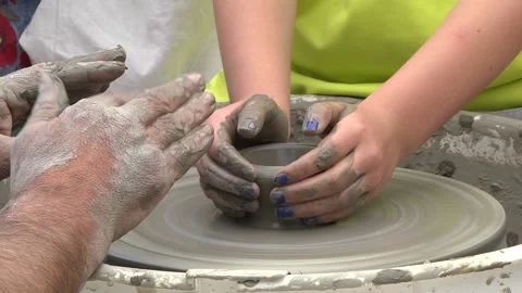 Pupils learn from potters how to model a clay jug at the wheel 88 Stock Footage 146542935
