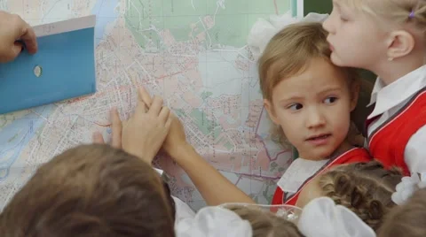 Pupils at the map on the school board Stock Footage 45863708