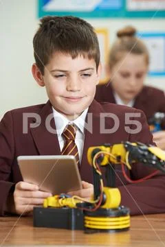 Pupils In Science Lesson Studying Robotics Stock Photos
