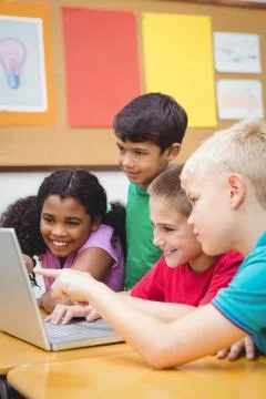 Pupils using a laptop in class Stock Photos