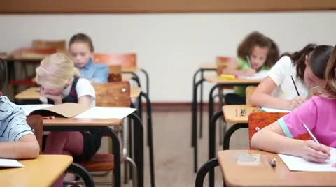 Pupils working in a classroom Stock Footage