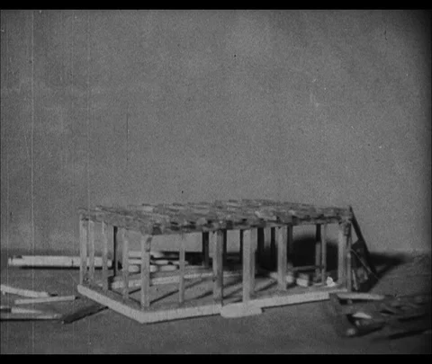 Puppet animation of frame of building coming together, 1946, UK Stock Footage 130673426