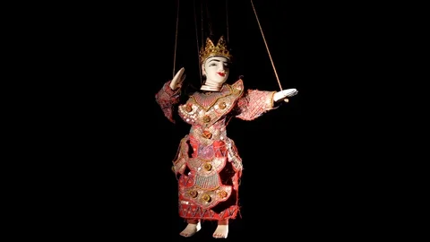 Puppet dancing on black background Stock Footage 122548302