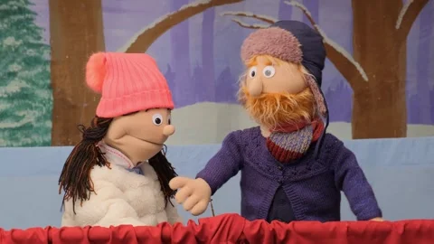 Puppet girl and boy performing on stage with red curtain and forest backdrop Stock Footage 342071682
