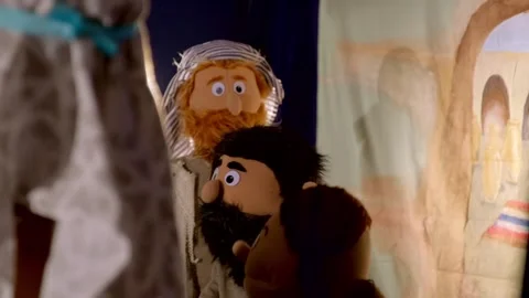 Puppet man with beard wearing turban performing indoors at nighttime Stock Footage 340886940