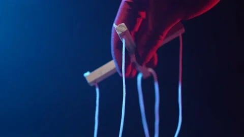 Puppet Master Controlling and Manipulating Closeup Stock Footage 158647649