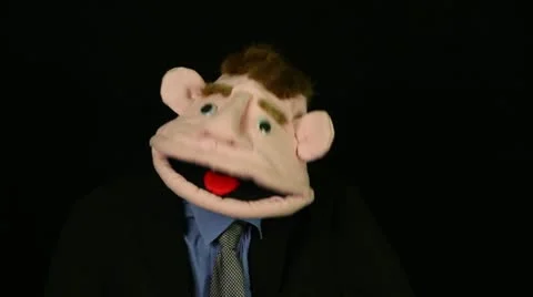 Puppet says on a black background Stock Footage 21296261