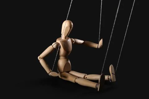 Puppet with strings on black background Stock Photos