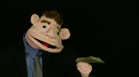 Puppet talking with bunch of money Stock Footage 21265878