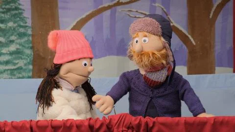 Puppets talking and looking at the camera. Stock Photos