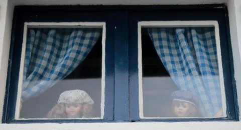 Puppets in the window Stock Photos