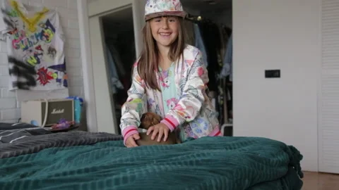 Puppy fun playing on the bed Stock Footage 151912980