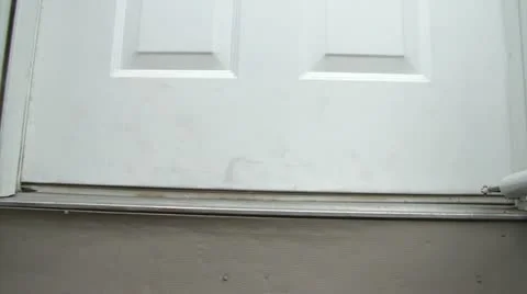 Puppy Greets at Front Door with Bone in Mouth Видео 12611858