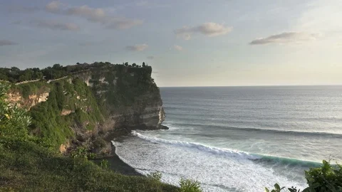 Pura Luhur Uluwatu. Bali Indonesia, the Panoramic view in time sunset Stock Footage