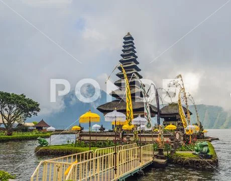 Pura Ulun Danu Bratan, Bali. Hindu temple surrounded by flowers on Bratan lake Stock Photos