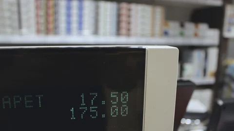 The purchase amount is displayed on the display of the cash register. Video stock 127396959