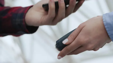 Purchase by cell-phone on electronic payment machine or card reader. E-money for Stock Footage 199480700