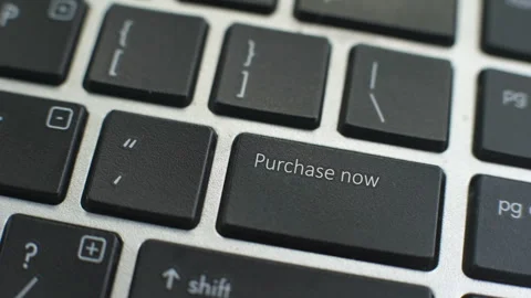 Purchase now button on computer keyboard, female hand fingers press key Stock Footage 98060571