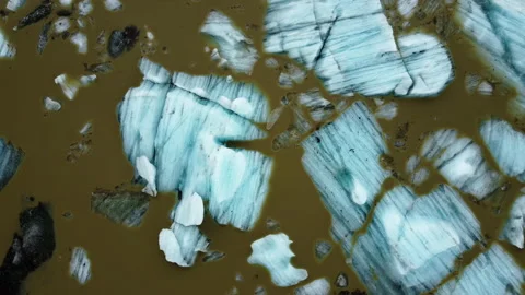 Pure Blue Ice with Volcanic Ash in Glacier Lagoon. Melting Glaciers in Iceland. Stock Footage 231585978