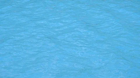 Pure blue water in pool with light reflections. Slow motion. Stock Footage 120792957