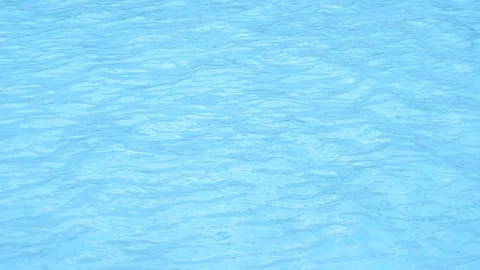 Pure blue water in pool with light reflections. Slow motion. Stock Footage 121198575