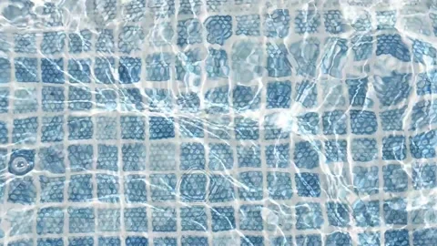 Pure blue water in the pool with light reflections Stock Footage 154163381