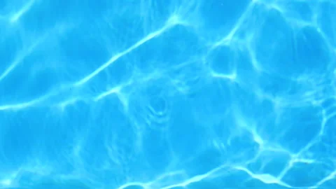 Pure blue water in pool with light reflections. Slow motion. tranquil water in a Stock Footage 157283411