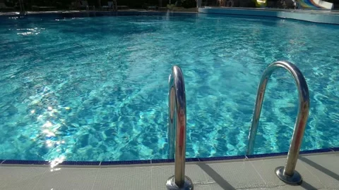 Pure blue water in the pool with light reflections Video stock 194907761