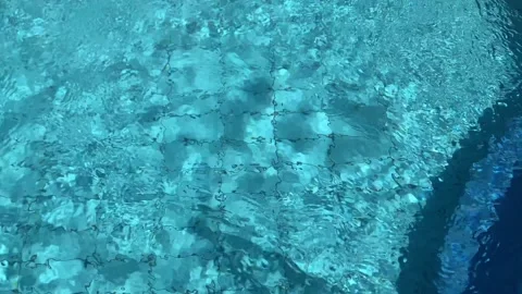 Pure blue water in the pool with light reflections. Slow motion. Cleaning proces Stock Footage 222049745