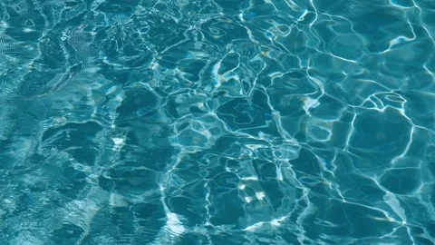 Pure blue water in the pool with light reflections. Slow motion Stock Footage 346721081