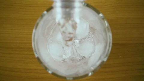 Pure carbonated drinking water from a bottle top view. Slow motion Stock Footage 76766747