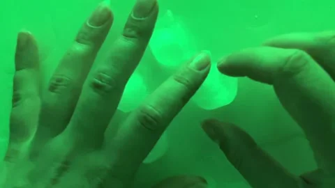 Pure clean Ice Cubes Melting On Mirror Surface In Neon Green Light Still Life Stock Footage 339200051