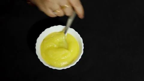 Pure desi ghee served in spoon showcasing traditional dairy ingredient and .. Stock Footage 336646085