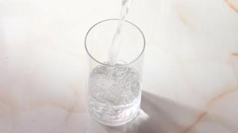 Pure drinking water being poured in a glass. Stock Footage 200707265