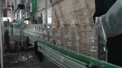 Pure drinking water plant. Work conveyor in the enterprise Stock Footage 130876310