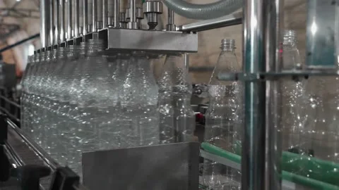 Pure drinking water plant. Work conveyor in the enterprise Stock Footage 130876797
