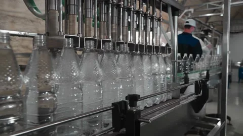Pure drinking water plant. Work conveyor in the enterprise Stock Footage 130877103