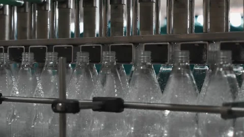 Pure drinking water plant. Work conveyor in the enterprise Stock Footage 130877670