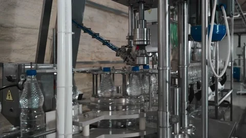 Pure drinking water plant. Work conveyor in the enterprise Stock Footage 130879104