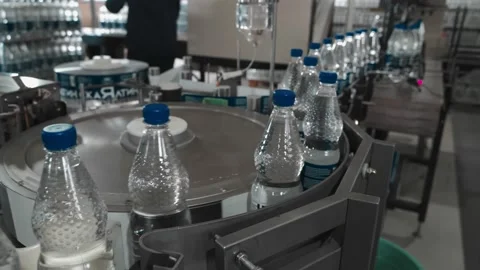 Pure drinking water plant. Work conveyor in the enterprise Stock Footage 130879277