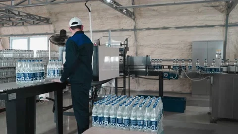Pure drinking water plant. Work conveyor in the enterprise Video stock 130879766