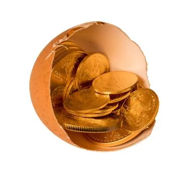 Pure gold coins in egg shell illustrating savings Isolated selection of pu... Stock Photos