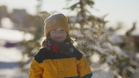 Pure joy captured as a cheerful boy dances in the snow celebrates the season and Stock Footage 293756853