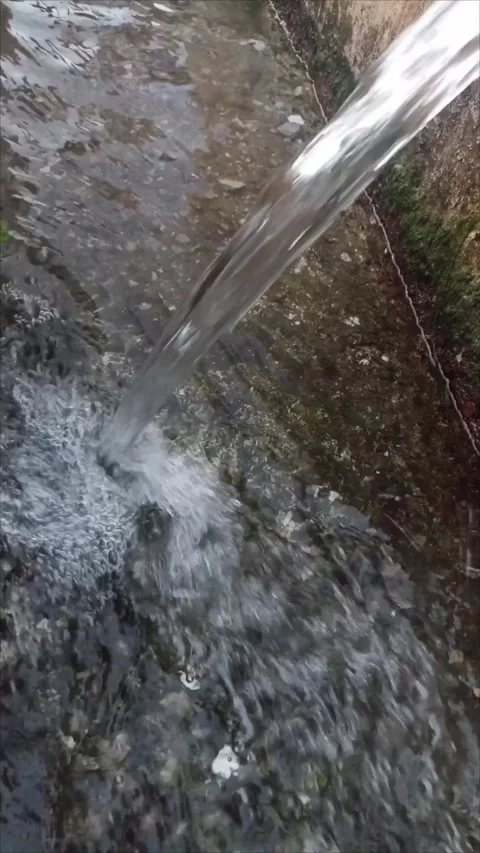 Pure Mountain Spring Water Flowing Through Metal Pipe Stock Footage 338336549