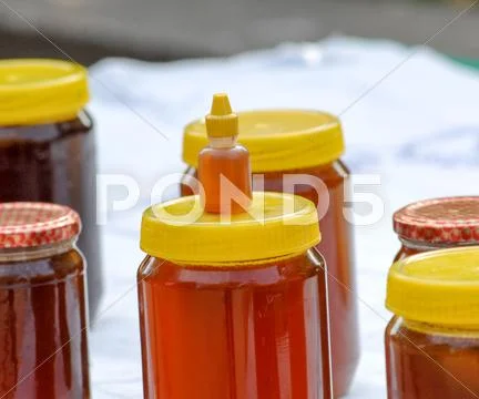 Pure organic honey jars for sale at open market Stock Photos