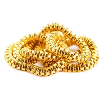 Pure solid gold chain necklace bracelet on white background Stock Photos