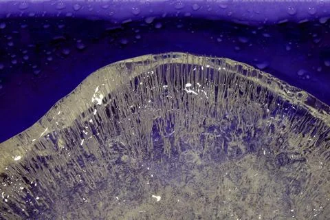 Pure transparent rectangular ice block with air bubbles Stock Photos