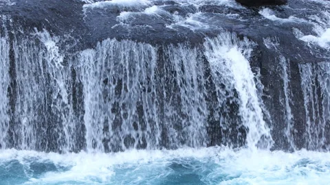 Pure water stream running through stone boulders, Wild mountain river splash 8k Stock Footage 235463214