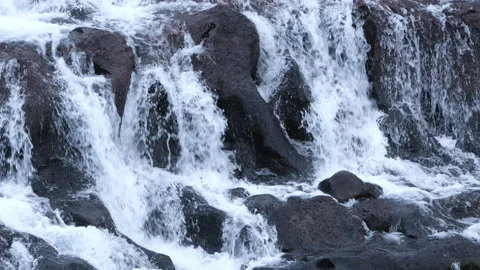 Pure water stream running through stone boulders, Wild mountain river splash 8k Stock Footage 235465444